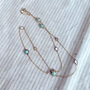 Kendra Scott: long gold necklace with turquoise accents